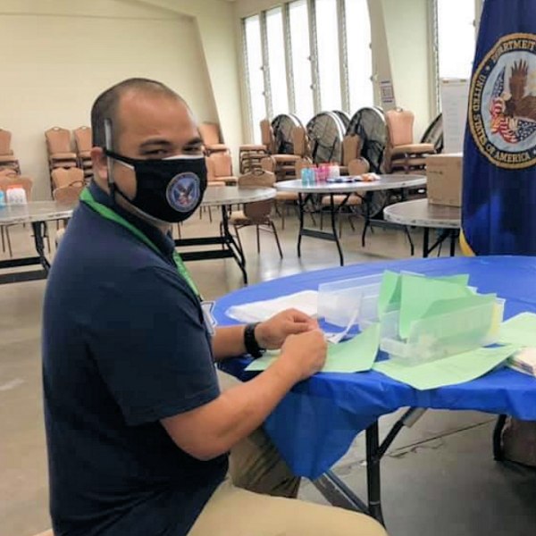 Pharmacist Chaz Barit prepares for a COVID-19 vaccination event at the veterans hall, Ke’ehi Lagoon Memorial, on the island of Oahu.