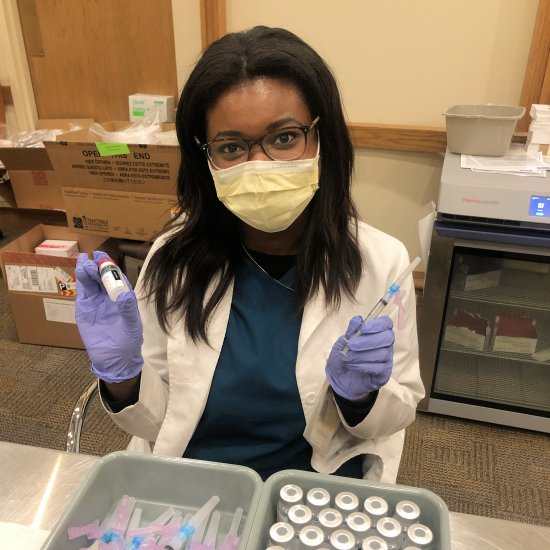 Pharmacist Tiffany Hatcher prepares vaccines for administration at a COVID-19 vaccination clinic in Pittsburgh, Pennsylvania.
