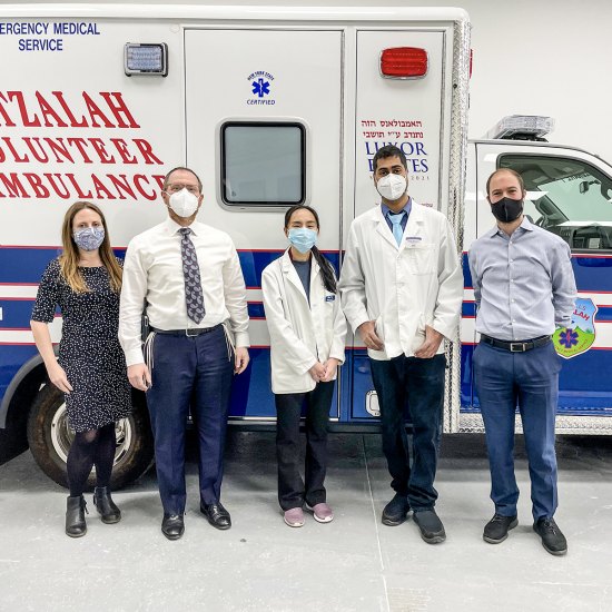 Ambar Keluskar (second from right) with clinicians and staff at a vaccine event hosted by Hatzalah Ambulance Corporation in Brooklyn, New York.
