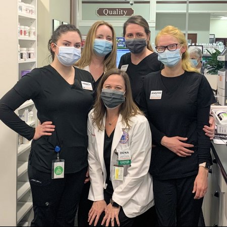 Pharmacists Dena Gill (front center) and Jennifer McPhail (back left) with Harris Teeter pharmacy team members prior to a COVID-19 vaccine clinic.