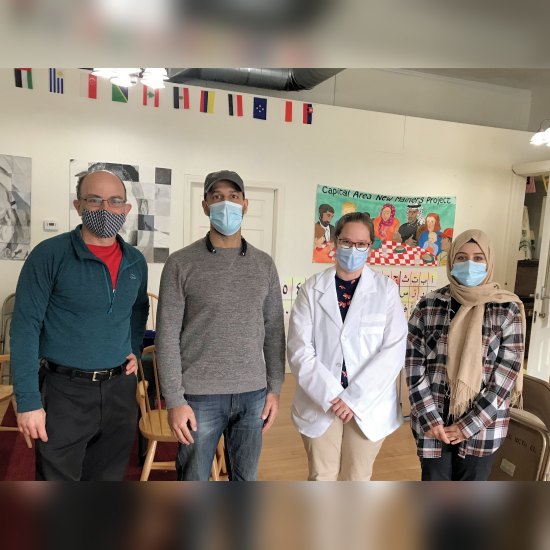 Pharmacist Amelia Arnold (second from right) at a COVID-19 vaccine pop-up clinic at the Augusta Multicultural Center in Maine. (Photo courtesy of Capital Area New Mainers Project.)