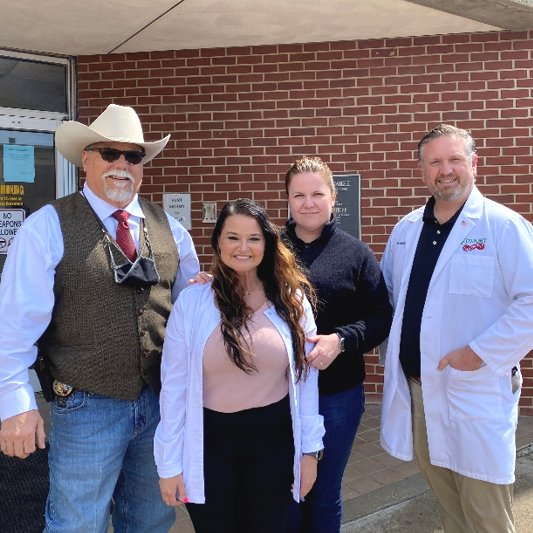 Pharmacist Chris Schiller (right) with the undersheriff and medical staff at Muskogee County Jail in Oklahoma.