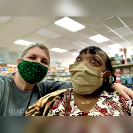 Pharmacist Rebecca Sorrell (left) meets altruistic community member Laquita Cole at Ritch’s Pharmacy in Mountain Brook, Alabama, for the first time.