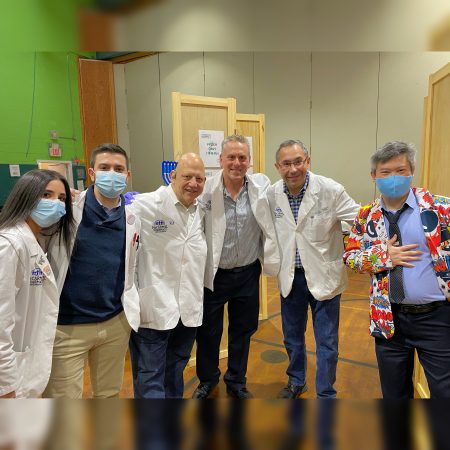 Pharmacist Roger Paganelli (3rd from left) and colleagues during a COVID-19 vaccine clinic set up at a school in Westchester County, New York.