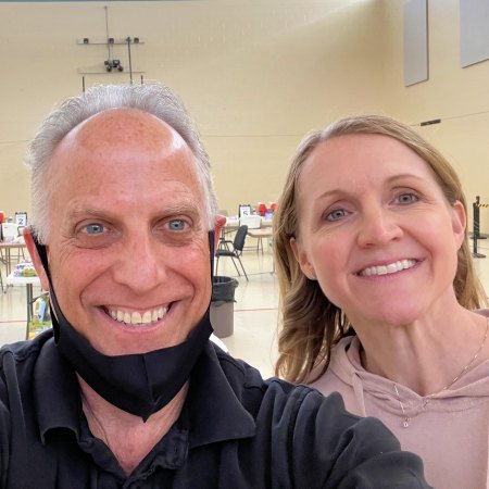 Randy McDonough, PharmD, and Kelly Kent, PharmD, co-owners of Towncrest Pharmacy Corporation, prepare for a mass COVID-19 vaccination event in the gymnasium at Solon United Methodist Church in Solon, Iowa.